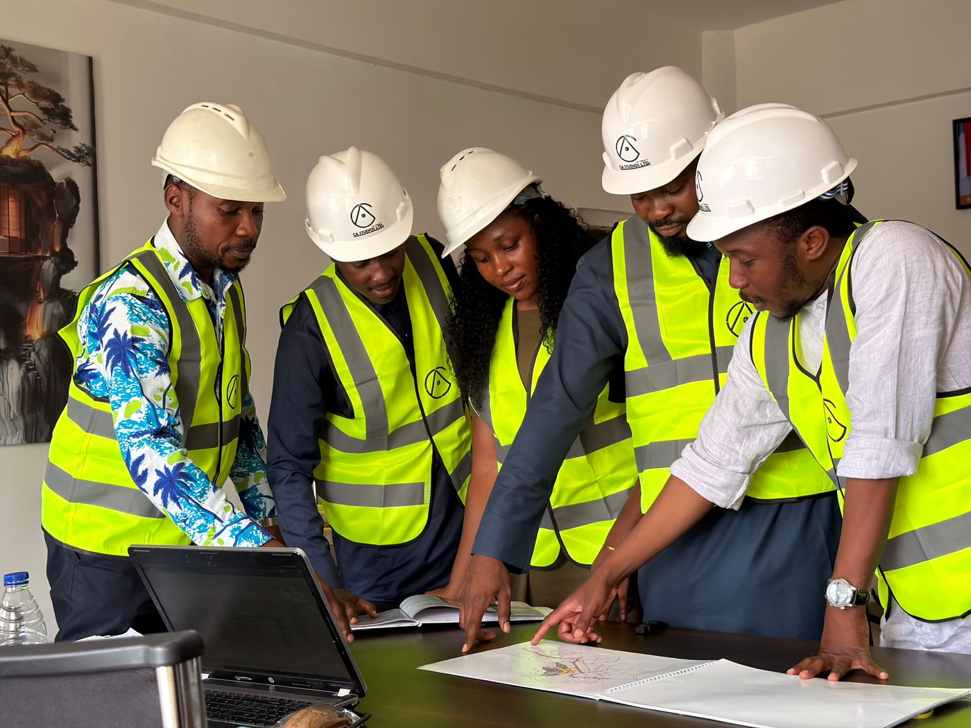 African engineering team in Abuja reviewing plans and coordinating system interfaces