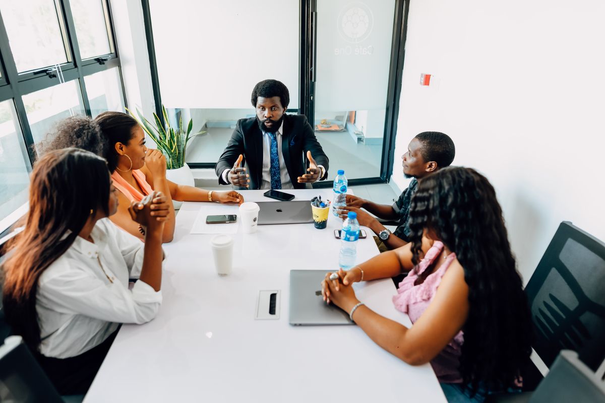 African operations team reviewing demand and capacity together in a Lagos office